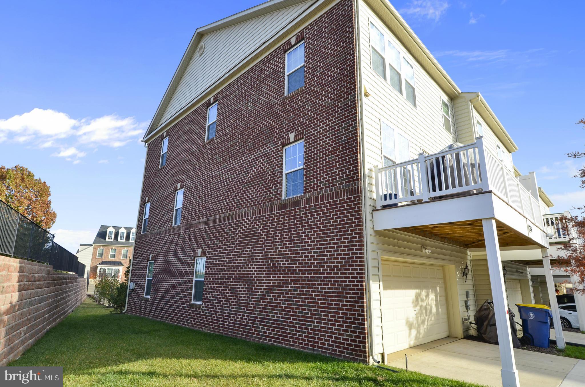 2526 Ralph Ellison Way Northeast Washington, DC 20018 - Photo 24 of 30 Side yard, garage access, and porch