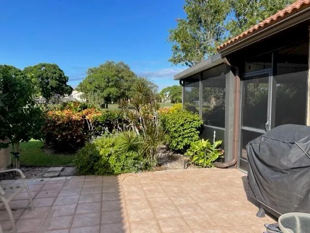 a backyard of a house with outdoor seating and green space