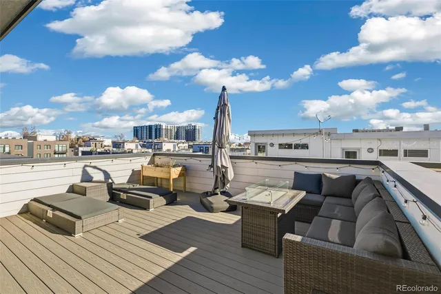 a view of a roof deck with couches