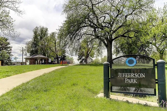 a view of park with swings and slides