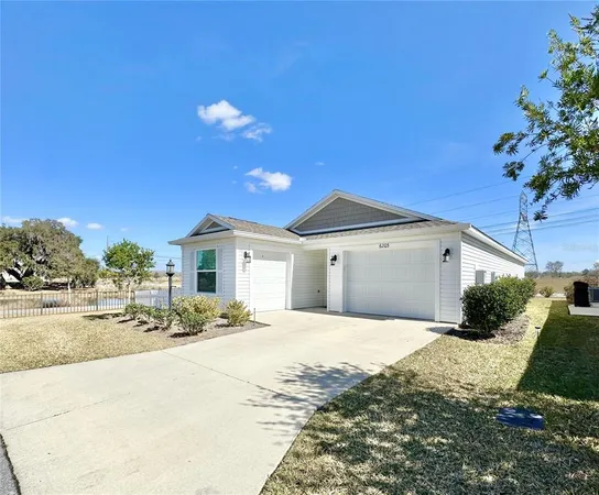a view of a house with backyard and deck