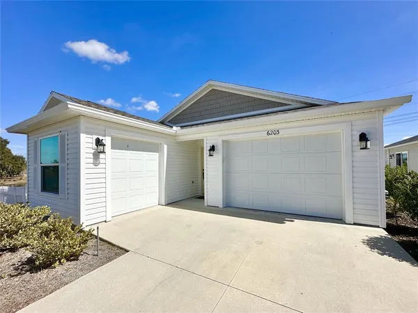 a front view of a house with a garage
