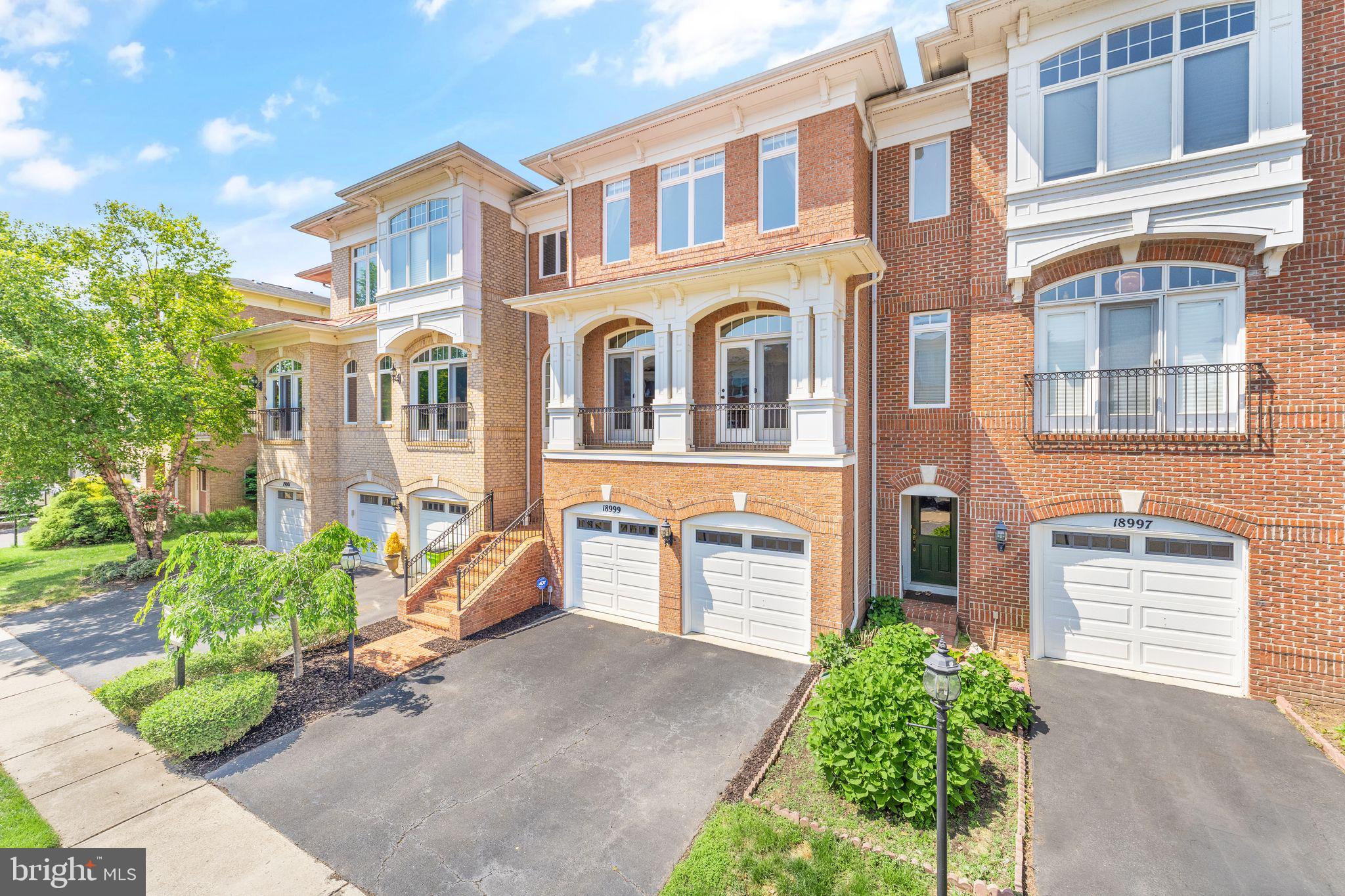 18999 Coreopsis Terrace Leesburg, VA 20176 - Photo 1 of 53 a front view of a multi story residential apartment building