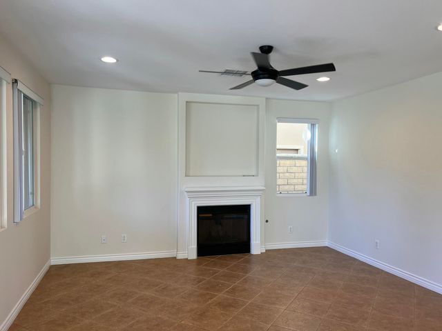 a view of empty room with fireplace