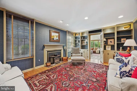 a living room with furniture fireplace and flat screen tv