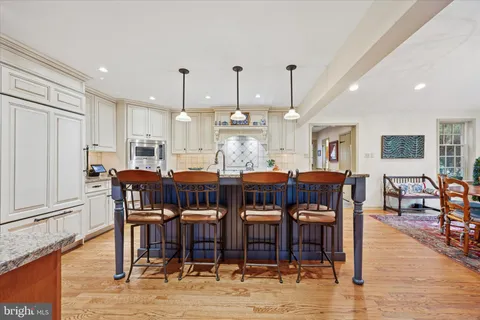a view of a dining area with furniture and wooden floor
