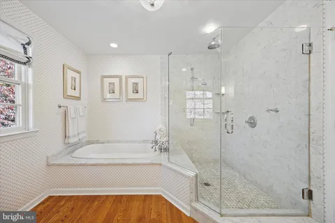 a bathroom with a bathtub and shower