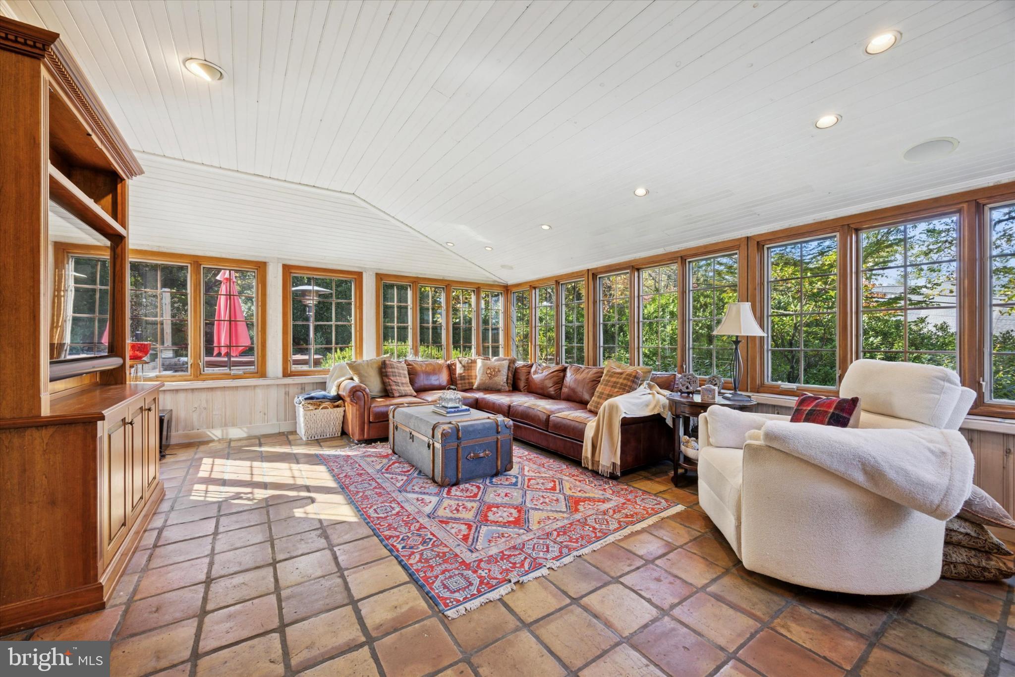 1532 Waverly Road Gladwyne, PA 19035 - Photo 8 of 40 a living room with patio furniture and a large window