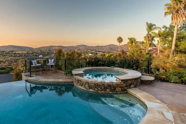 an aerial view of a house with a big yard