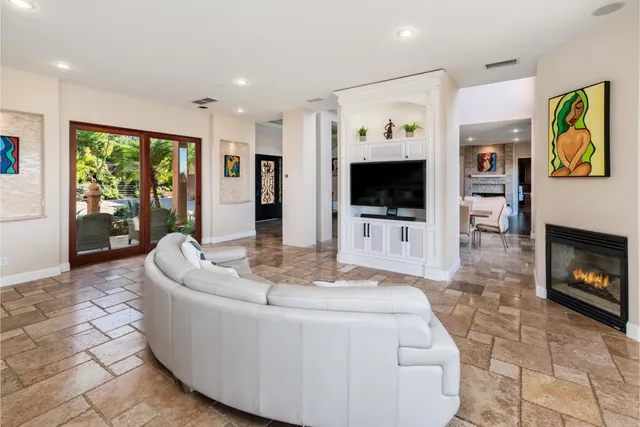 a large kitchen with a table and chairs