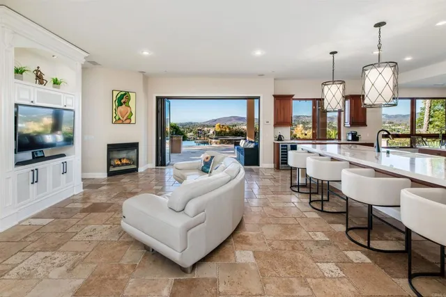 a living room with fireplace furniture and a wooden floor