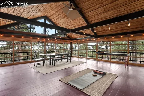 a outdoor space with lots of wooden furniture