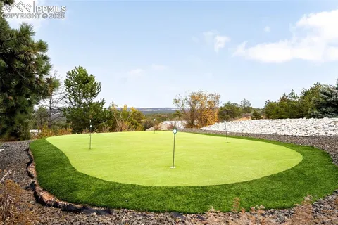 a view of a swimming pool with a lake view