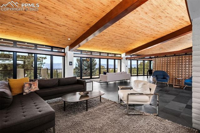 a outdoor living space with furniture and a ceiling fan