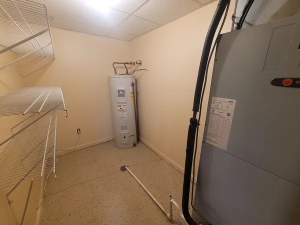 a view of storage and utility room with a sink