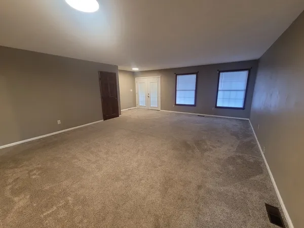 an empty room with windows