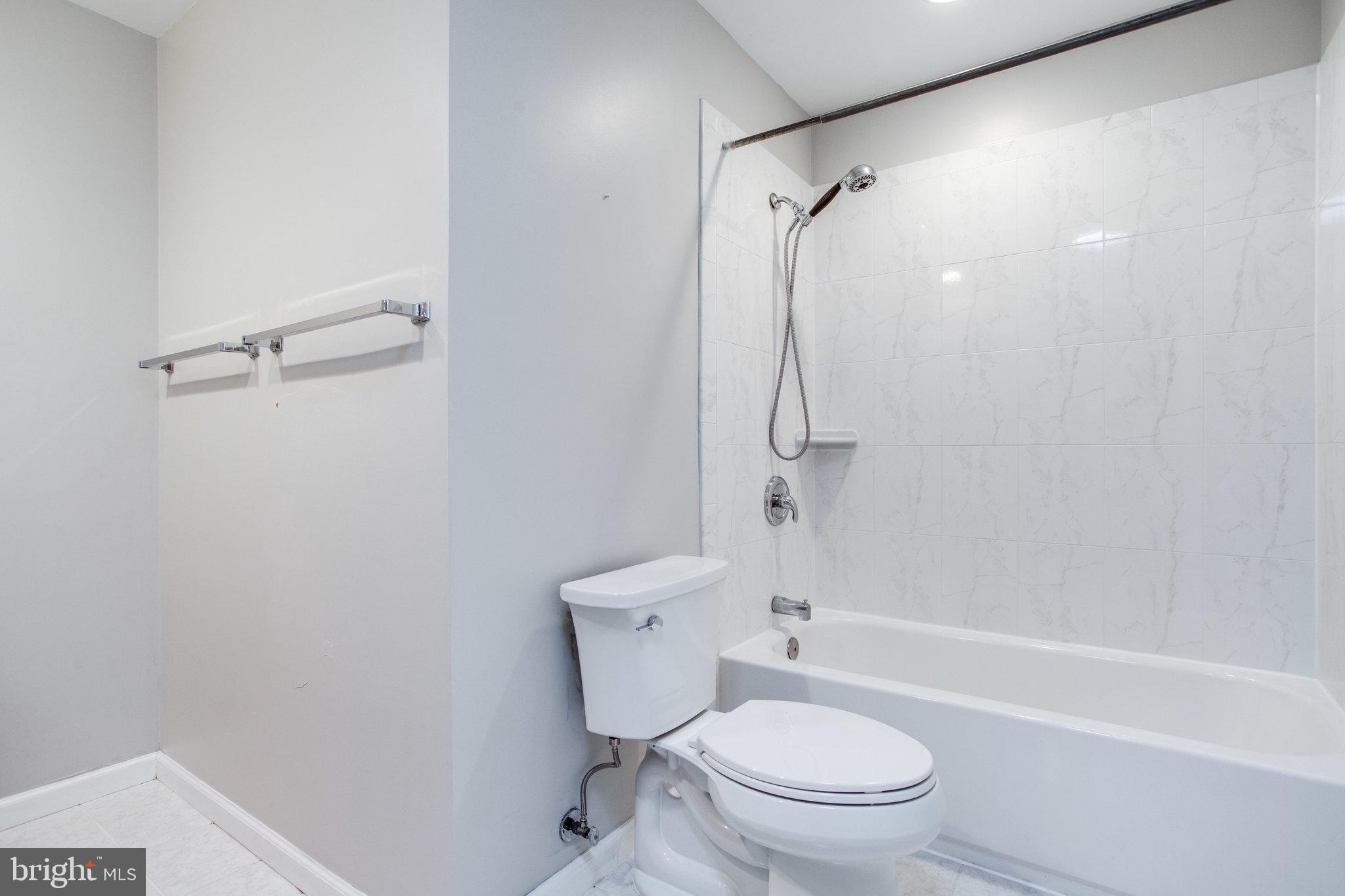 8500 Brook Road McLean, VA 22102 - Photo 31 of 44 a bathroom with a toilet and shower