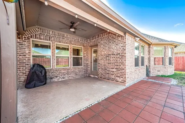 a view of a house with a barbeque