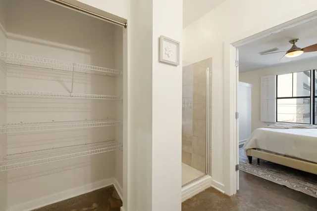 a view of a livingroom with furniture wooden floor a chandelier