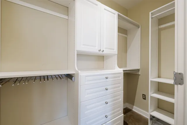 a bed room with a bed mirror and a window