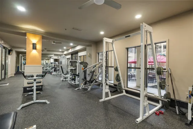 a living room with furniture a rug and a table