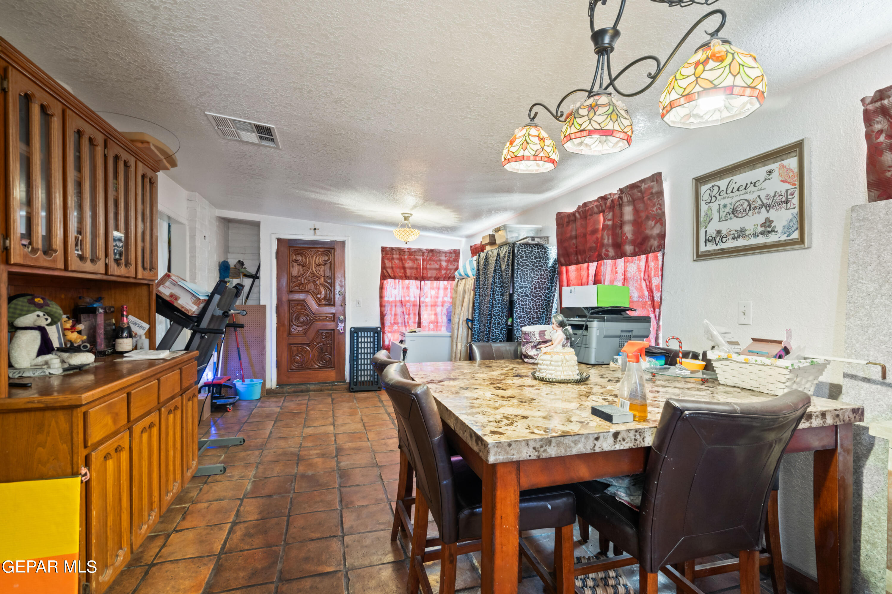 7828 Caliche Drive El Paso, TX 79915 - Photo 12 of 34 a view of a dining area with furniture
