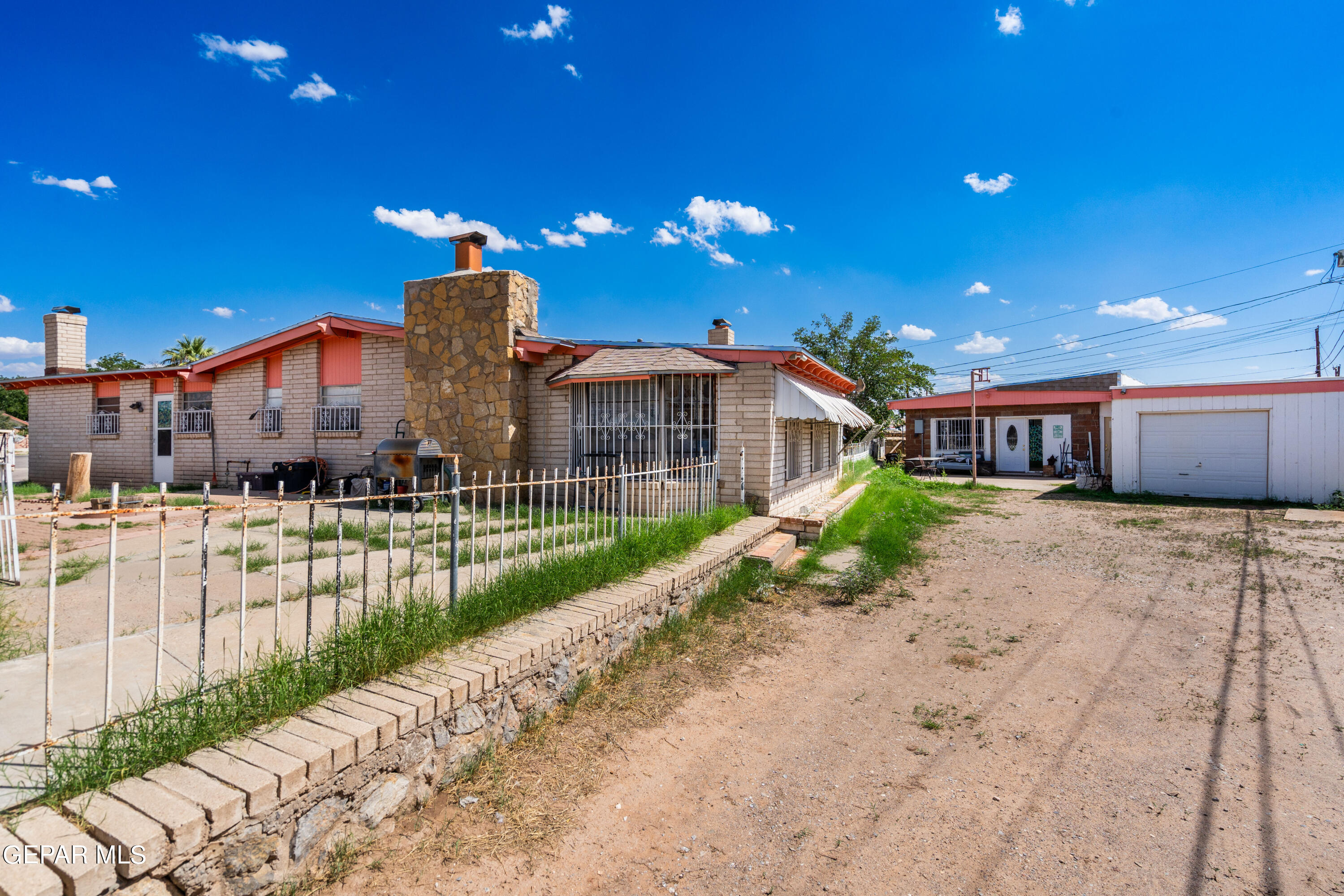 7828 Caliche Drive El Paso, TX 79915 - Photo 2 of 34 a front view of a house with a yard