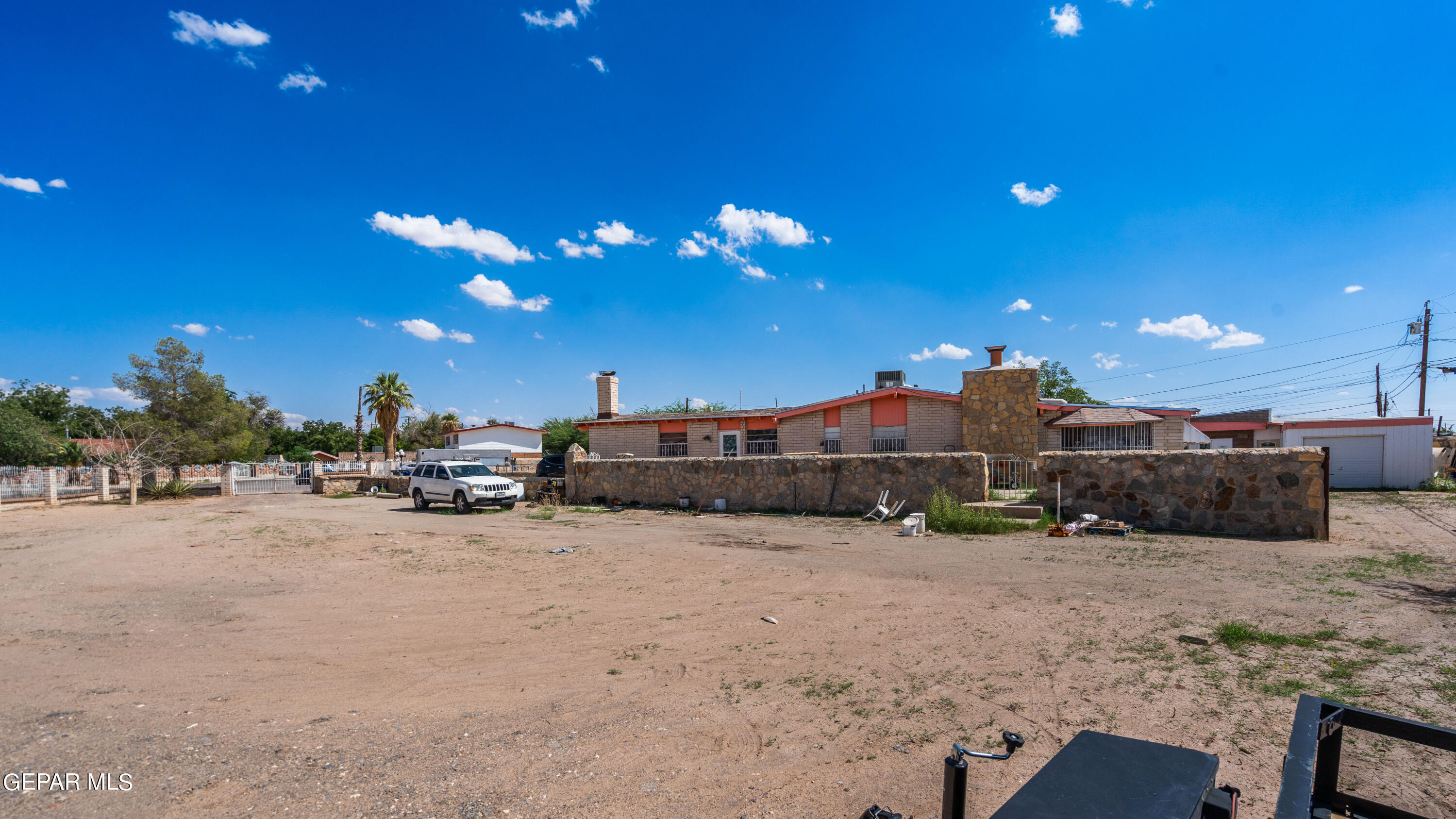 7828 Caliche Drive El Paso, TX 79915 - Photo 4 of 34 a view of a house with a yard