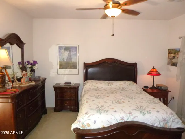 a bedroom with a bed and a dresser