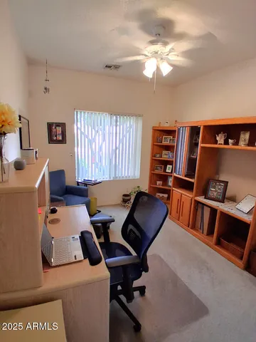 a workspace with furniture and window