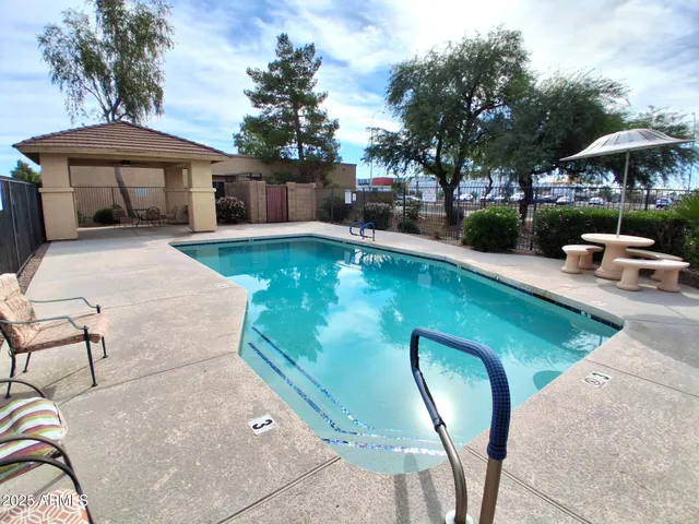 a view of a swimming pool with a patio