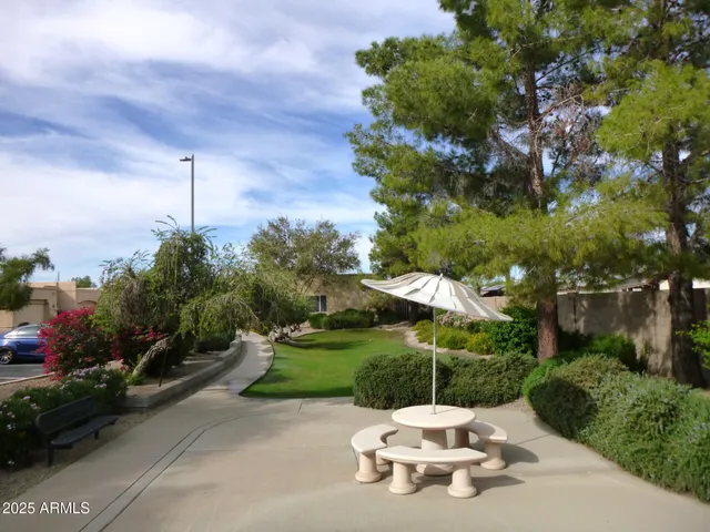 a white house with yard in front of it