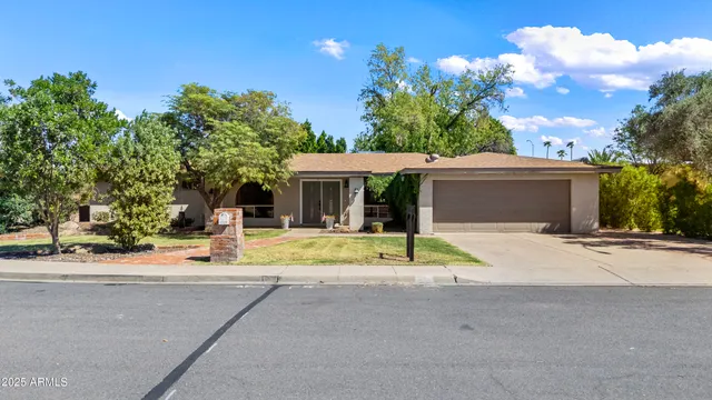 a view of a wooden house with a yard