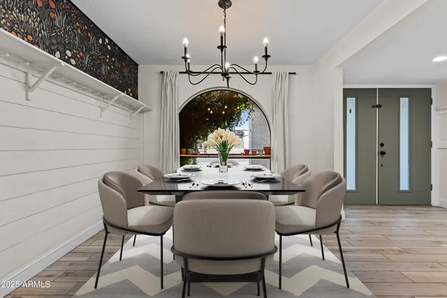 a view of a hallway with wooden floor and entryway