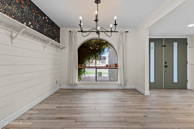 a living room with furniture a fireplace and wooden floor