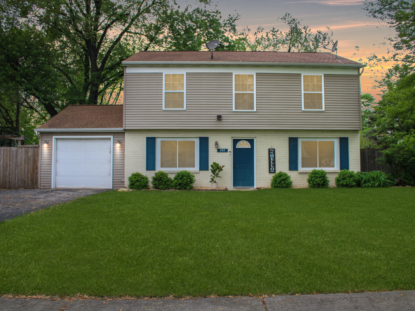 552 Spruce Road Bolingbrook, IL 60440 - Photo 1 of 18 a front view of a house with a garden