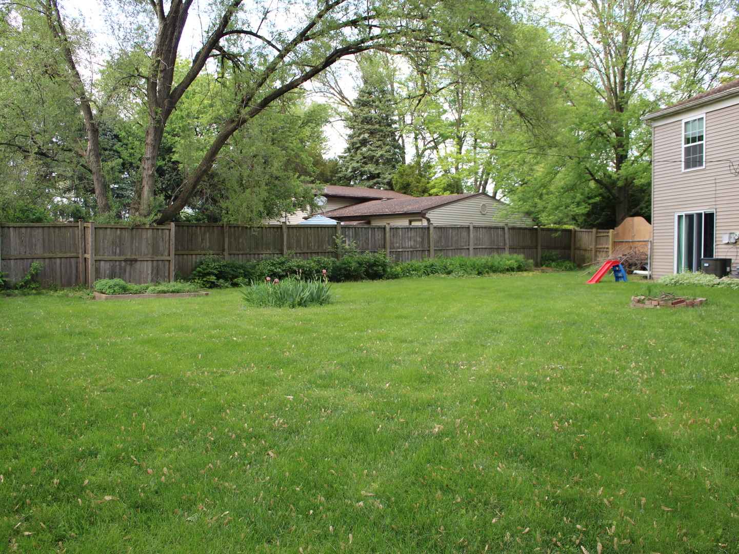 552 Spruce Road Bolingbrook, IL 60440 - Photo 17 of 18 a view of a backyard with a garden