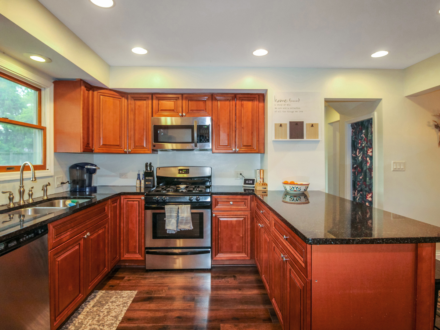 552 Spruce Road Bolingbrook, IL 60440 - Photo 2 of 18 a kitchen with stainless steel appliances granite countertop a stove a sink dishwasher a refrigerator and a microwave