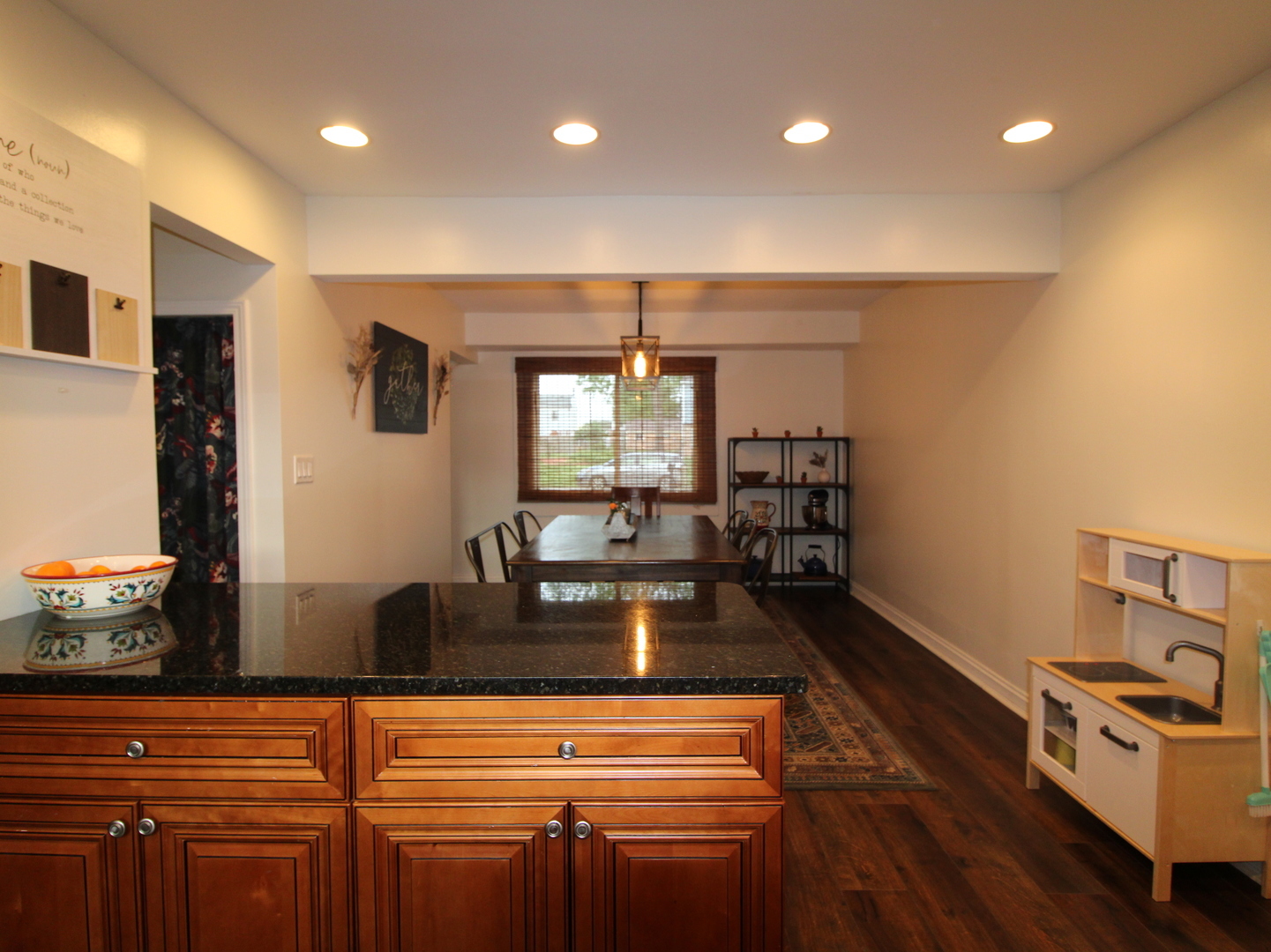 552 Spruce Road Bolingbrook, IL 60440 - Photo 8 of 18 a kitchen with kitchen island a counter top space a sink and appliances