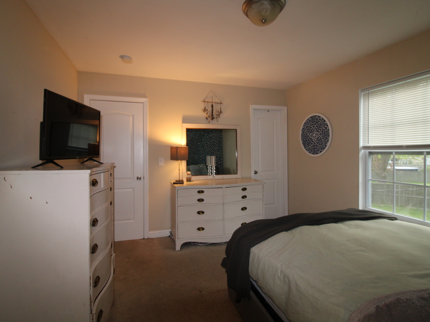 552 Spruce Road Bolingbrook, IL 60440 - Photo 9 of 18 a bedroom with a bed and flat screen tv
