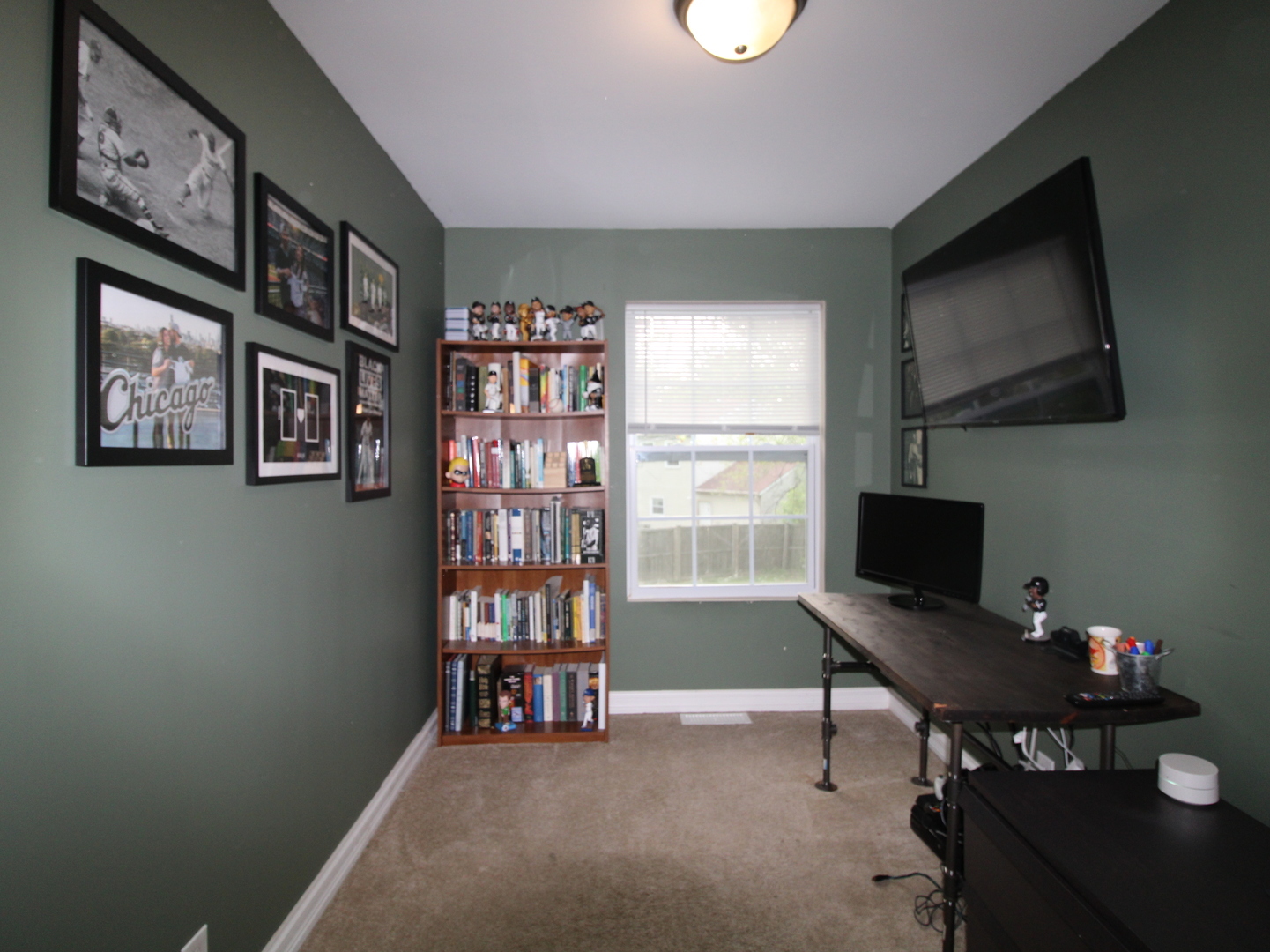 552 Spruce Road Bolingbrook, IL 60440 - Photo 10 of 18 a view of a workspace with furniture and a window