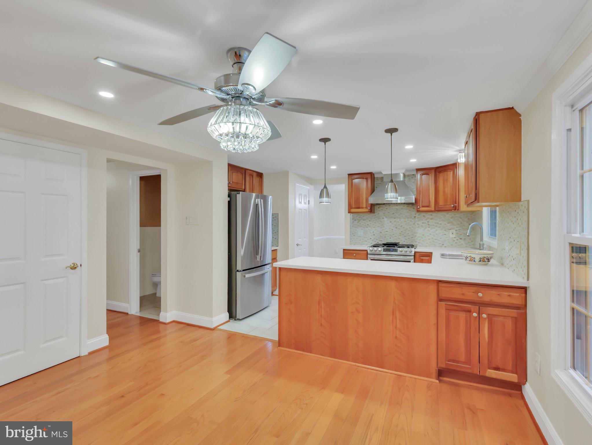 18 Windmill Court Silver Spring, MD 20905 - Photo 8 of 37 Modern kitchen with warm wood accents.