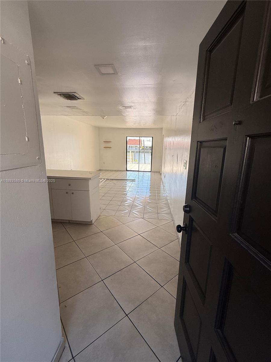 5530 West 26th Court, Unit 104 Hialeah, FL 33016 - Photo 12 of 14 a bathroom with a sink and mirror