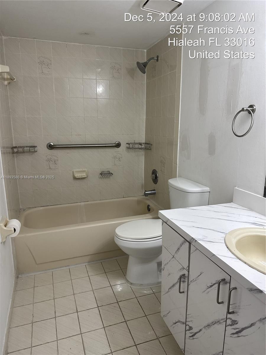 5530 West 26th Court, Unit 104 Hialeah, FL 33016 - Photo 4 of 14 a bathroom with a sink a toilet and shower