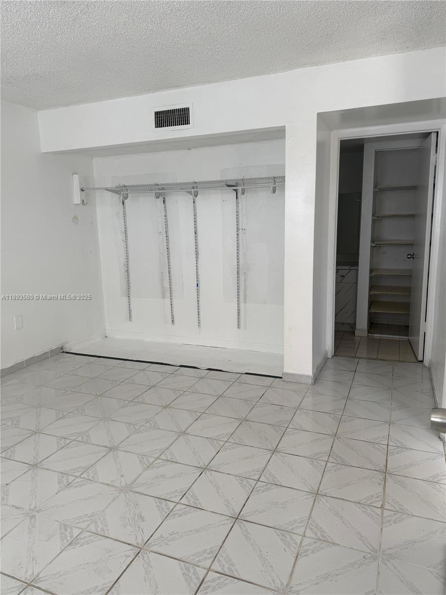 5530 West 26th Court, Unit 104 Hialeah, FL 33016 - Photo 6 of 14 an empty room with a empty space