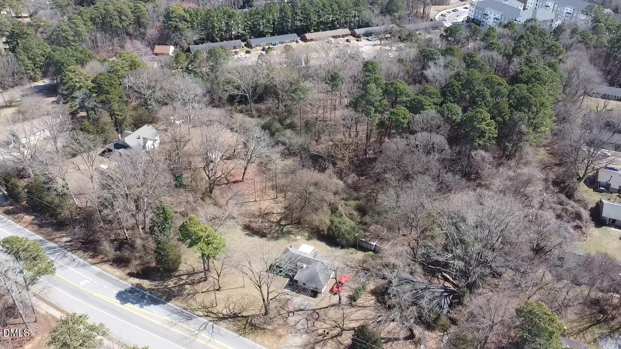 2521 Lake Wheeler Road Raleigh, NC 27603 - Photo 7 of 10 a view of a dry yard with trees and bushes