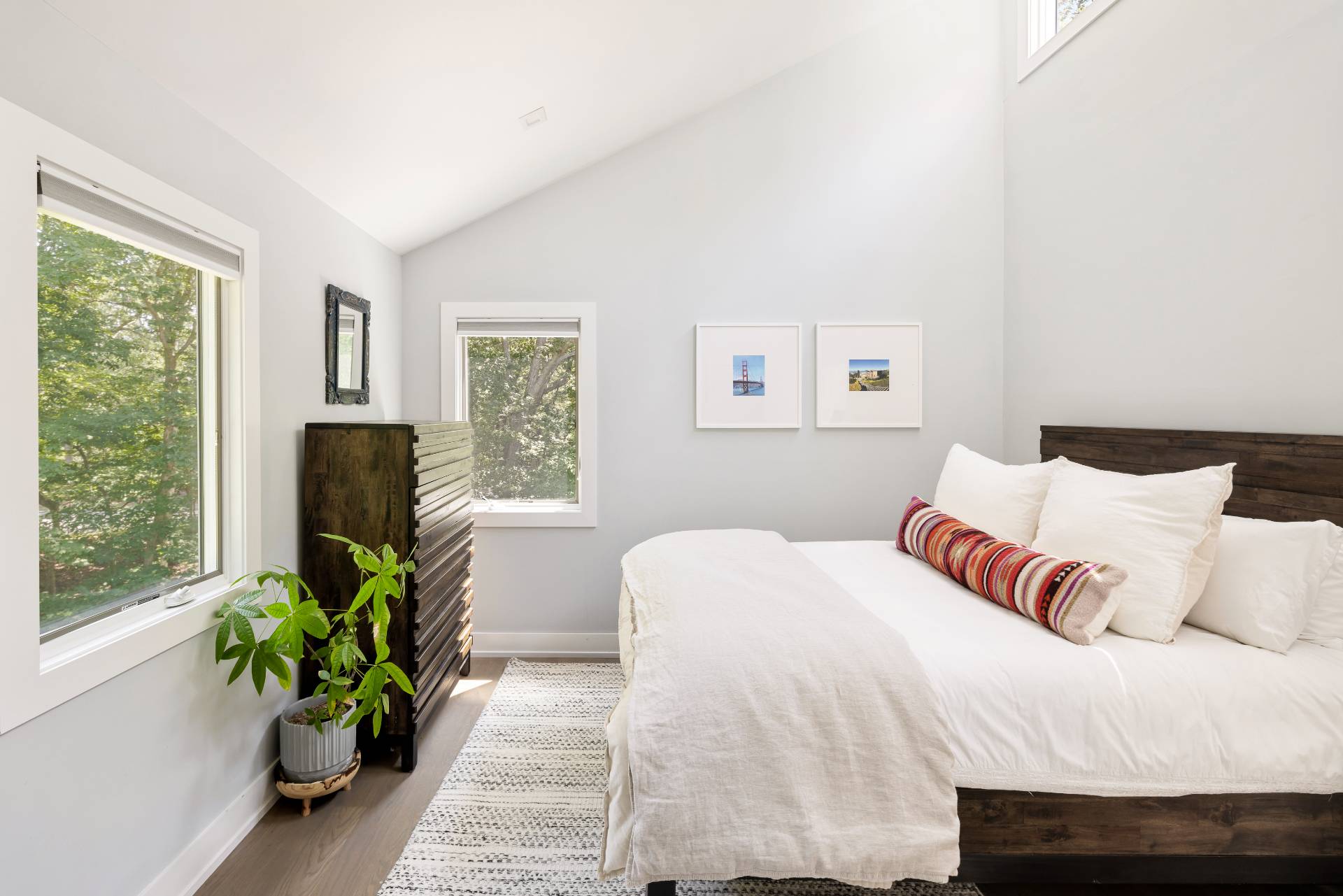 27 Landfall Road East Hampton, NY 11937 - Photo 11 of 24 a bedroom with a bed and a large window