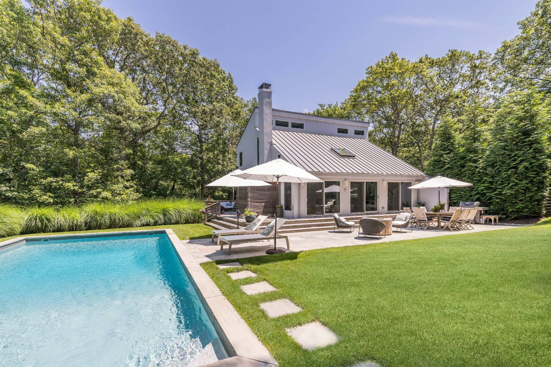 27 Landfall Road East Hampton, NY 11937 - Photo 19 of 24 a view of a house with swimming pool and sitting area