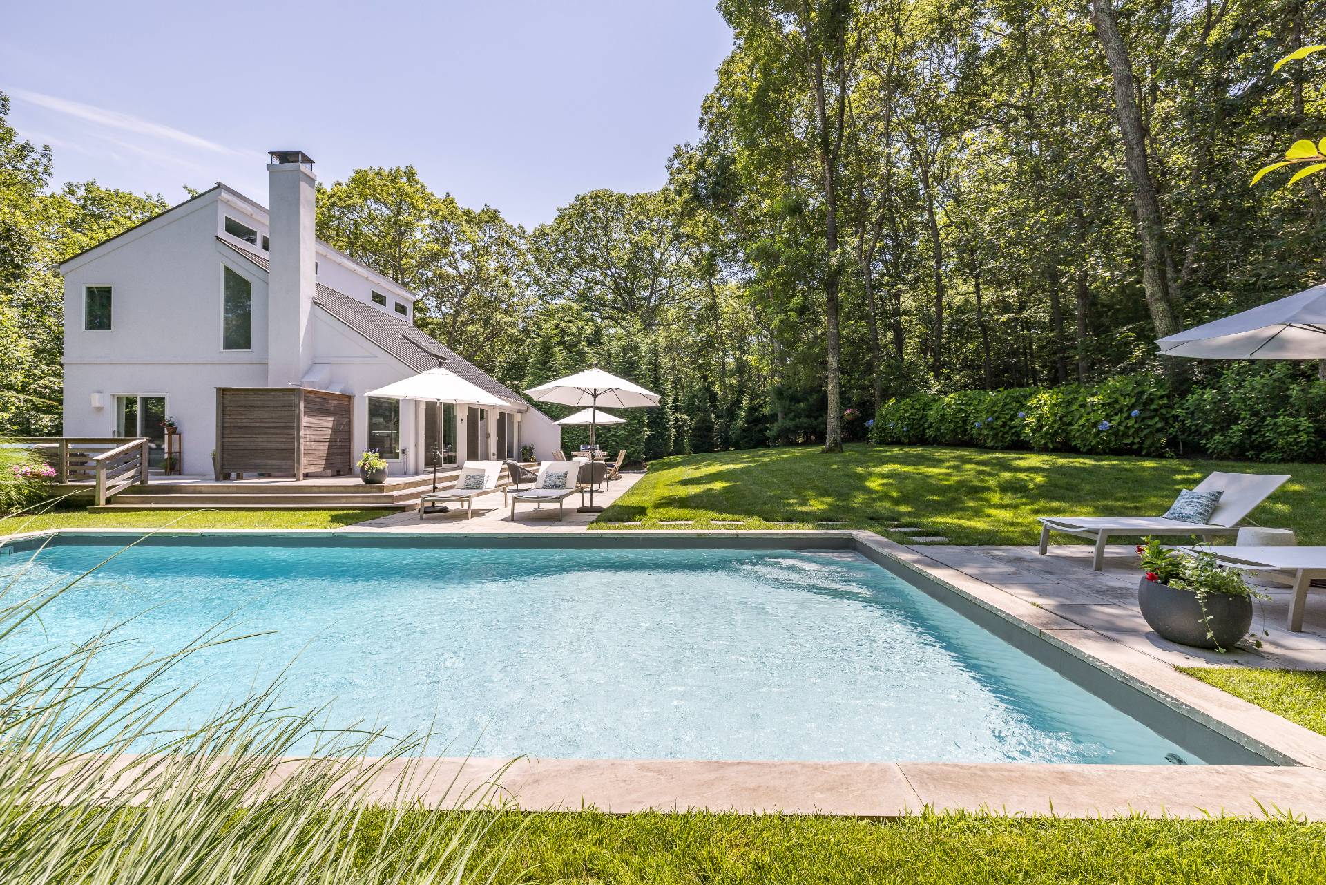 27 Landfall Road East Hampton, NY 11937 - Photo 2 of 24 a house view with swimming pool and yard