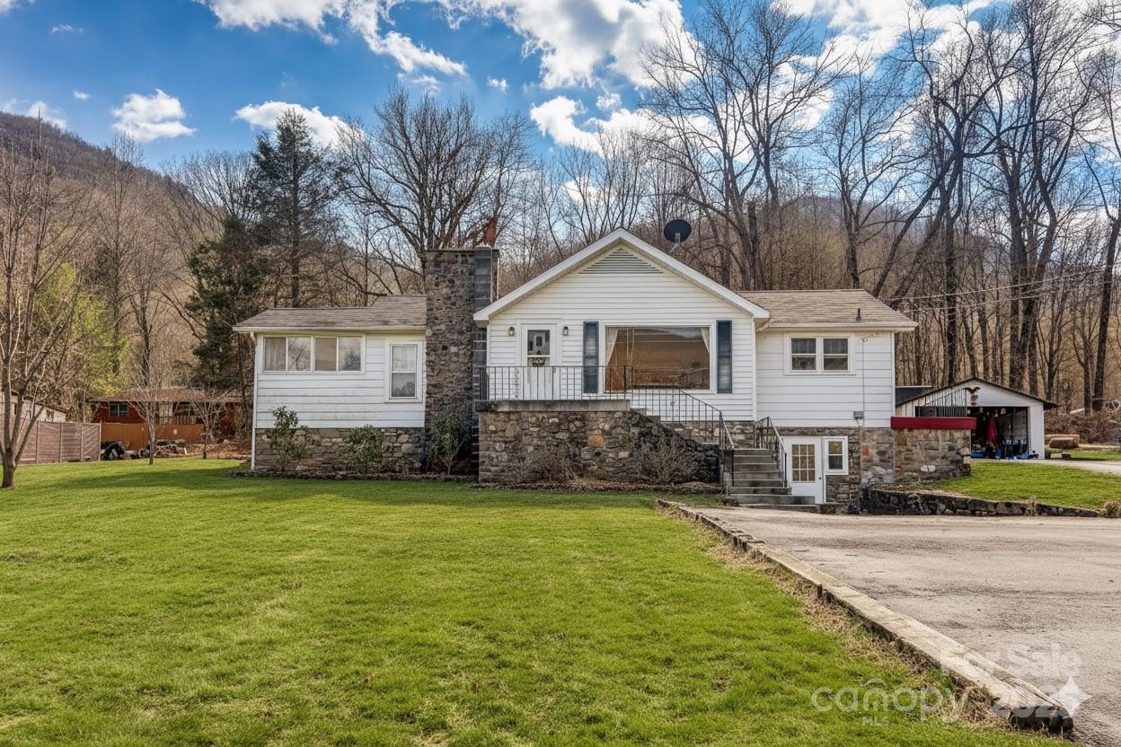 1639 Soco Road Maggie Valley, NC 28751 - Photo 1 of 15 a front view of a house with a yard